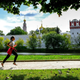 A woman jogs near the Novodevichy Convent in central Moscow on September 14, 2020.